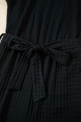 Black Checkered Mesh One Shoulder Short Sleeve Knotted Waist Jumpsuit Jumpsuits & Rompers JT's Designer Fashion